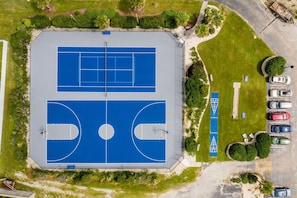 An aerial view of a basketball court with a parking lot and trees. - Paradise Palms! in A Place At The Beach Resort on the OCEAN & the BEST pools! (Atlantic Beach)