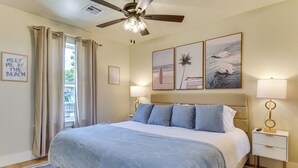 A bedroom with a bed, a ceiling fan, a nightstand with a lamp, and artwork on the wall. - 12 Mi to BOK Center: Pet-friendly Home w/ Yard! (Tulsa)