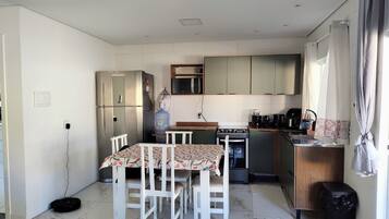 Comfort House | Private kitchen | Fridge, microwave, cookware/dishes/utensils, dining tables