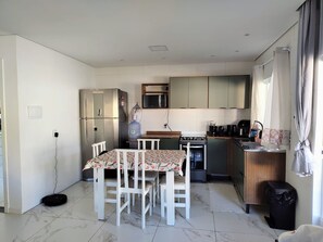 Comfort House | Private kitchen | Fridge, microwave, cookware/dishes/utensils, dining tables