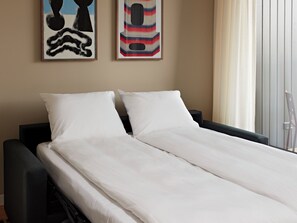 Apartment, 1 Bedroom | Living area | 40-inch Smart TV with satellite channels, streaming services