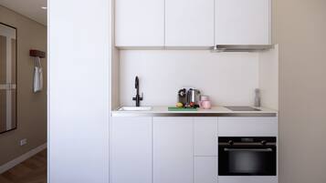 Appartement, 1 slaapkamer | Privékeuken | Een koelkast/vriezer, een magnetron, een oven, een kookplaat