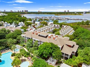 A resort with a swimming pool, docked boats, and a marina. - Baytowne Wharf Condo with Walk Out Patio (Miramar Beach)