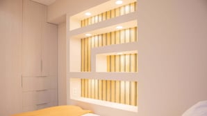 A bedroom with a bed, a wardrobe, and built-in lighting on the wall. - w Bright 3BR w Balcony in Vibrant Miraflores (Lima)