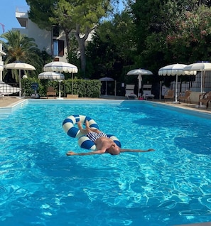 Seasonal outdoor pool, pool umbrellas, pool loungers