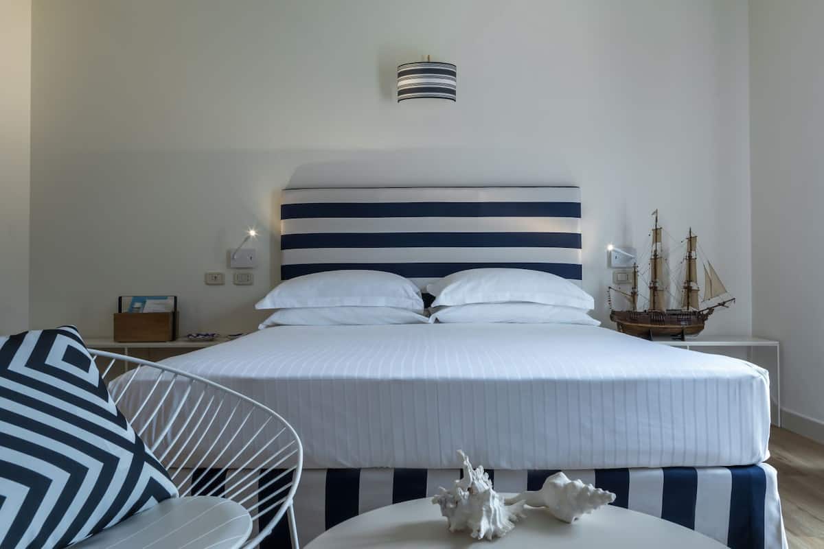 Family Room, Sea View | In-room safe, desk, blackout drapes, soundproofing