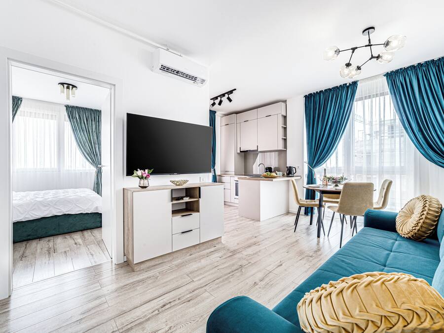 Premium Apartment, 1 Bedroom, Balcony | Living area | 40-cm flat-screen TV with cable channels