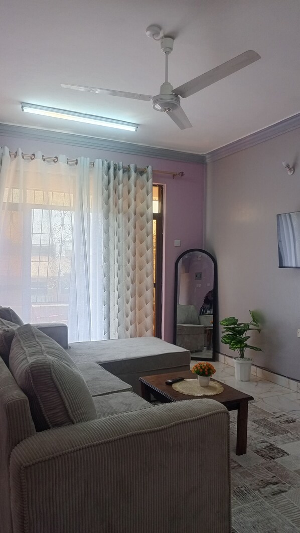 Living area - Cozy Safe Space. With 2 balconies, nice city view, Free parking. Family-friendly! (Mombasa)