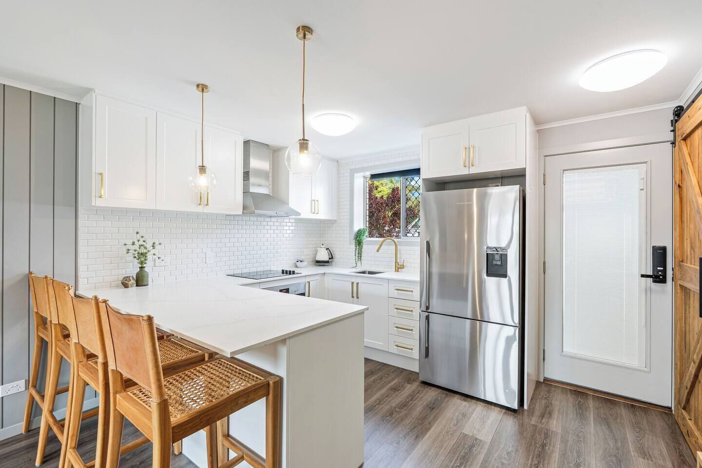 Share quick bites at the kitchen’s breakfast bar with seating for four.