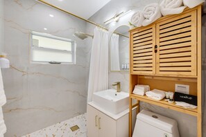 Shower, hair dryer, towels, soap