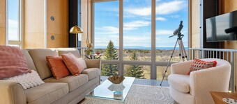 Award-winning 9-level Chameleon House in Leelanau County. A modern-industrial masterpiece with reflective siding, rooftop deck, and epic Lake Michigan views near beaches and Fishtown.