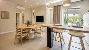 A modern kitchen with a central island, pendant lights, and a view to the outdoors. - 'Picahouse' Apartment with Sea View, Wi-Fi & Air Conditioning near Cefalù (Sant'Onofrio)