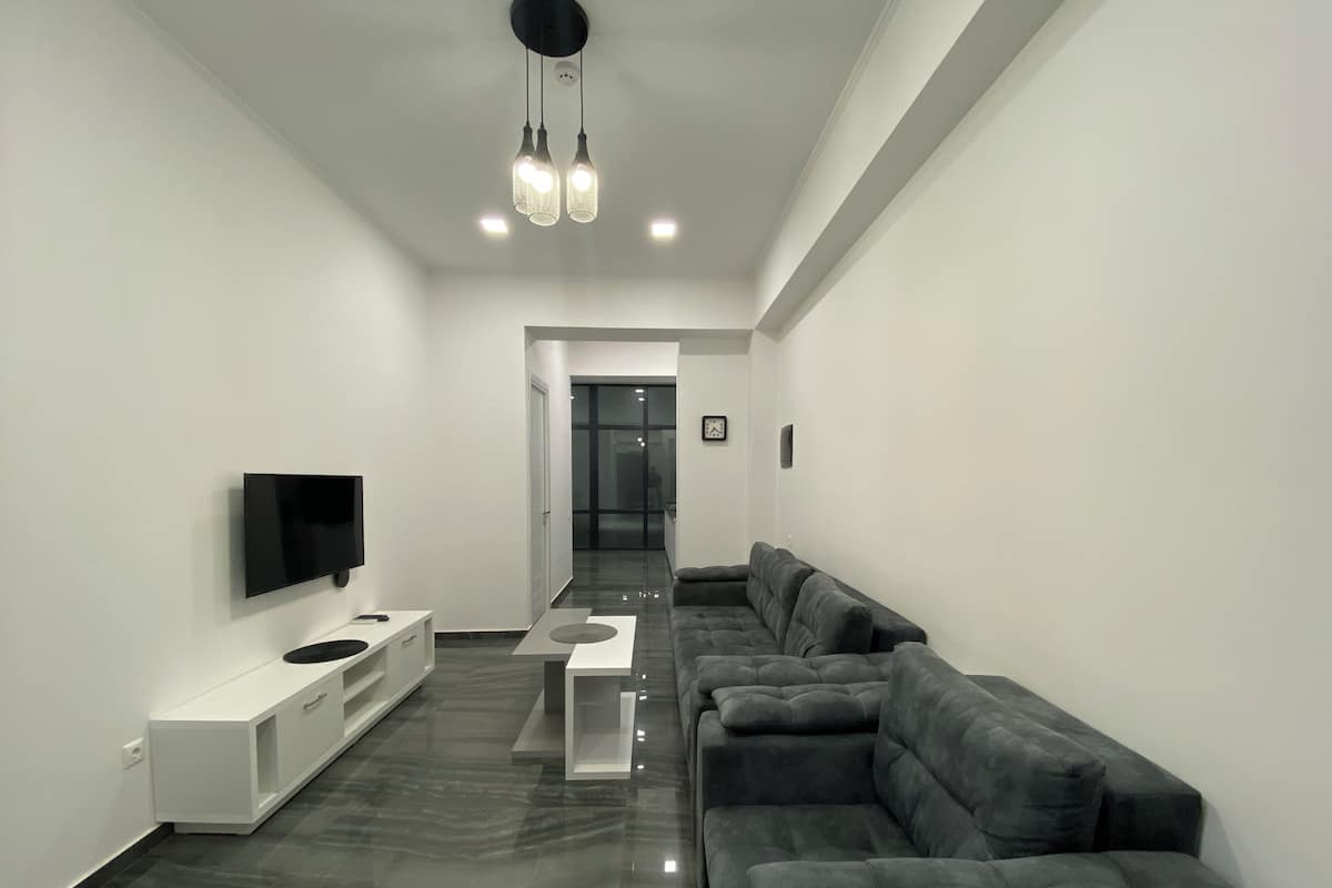 Superior Apartment, Balcony | Living area | 50-inch flat-screen TV with cable channels