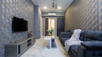 Televisión de pantalla plana de 50 pulgadas con canales por cable