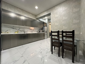 Business Apartment, Balcony | Private kitchen | Microwave, stovetop, electric kettle, cookware/dishes/utensils