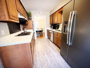 Fridge, microwave, oven, stovetop -
4BR Memphis Retreat Game Backyard Prime Location (Memphis)