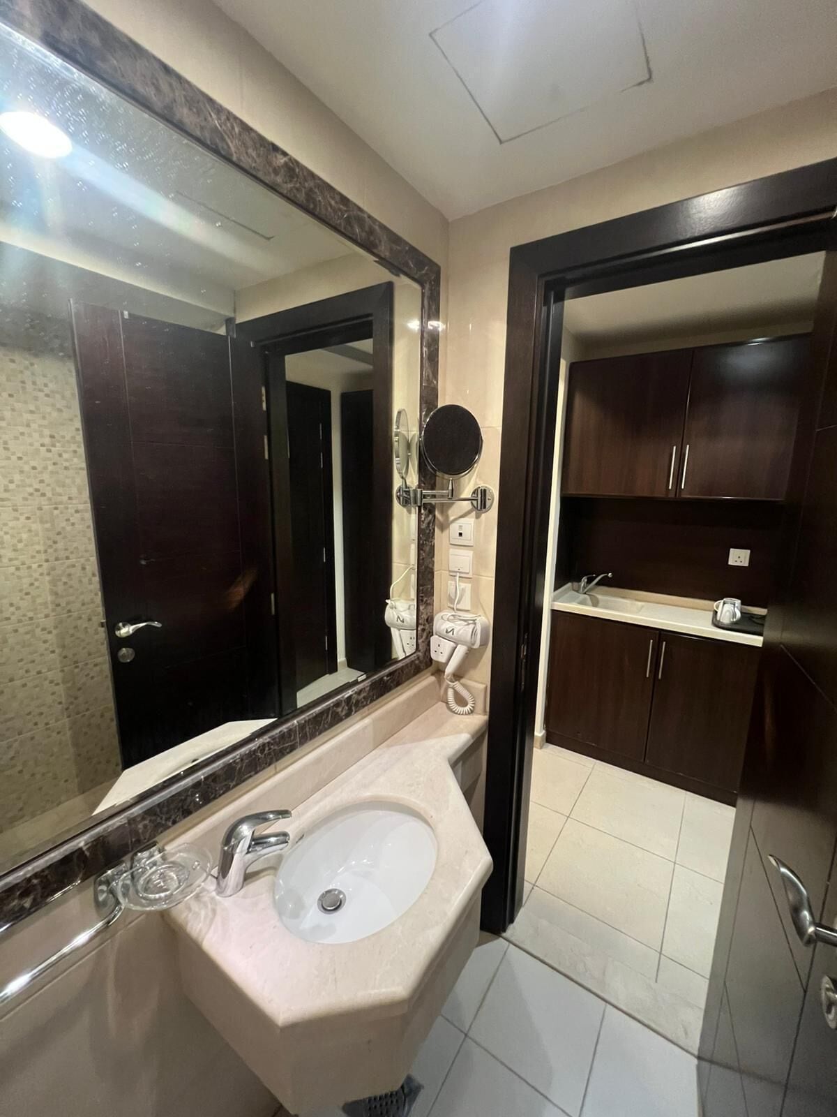 Shower, hair dryer, slippers, towels