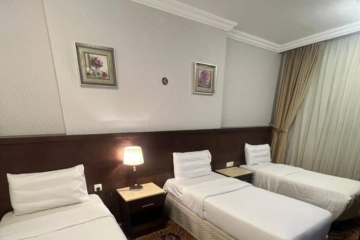 Deluxe Triple Room, City View | In-room safe, blackout drapes, soundproofing, iron/ironing board