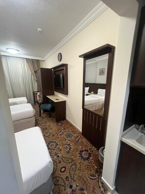 Deluxe Triple Room, City View | In-room safe, blackout drapes, soundproofing, iron/ironing board