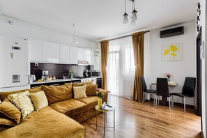 Superior Apartment, Balcony, City View | Living area | TV