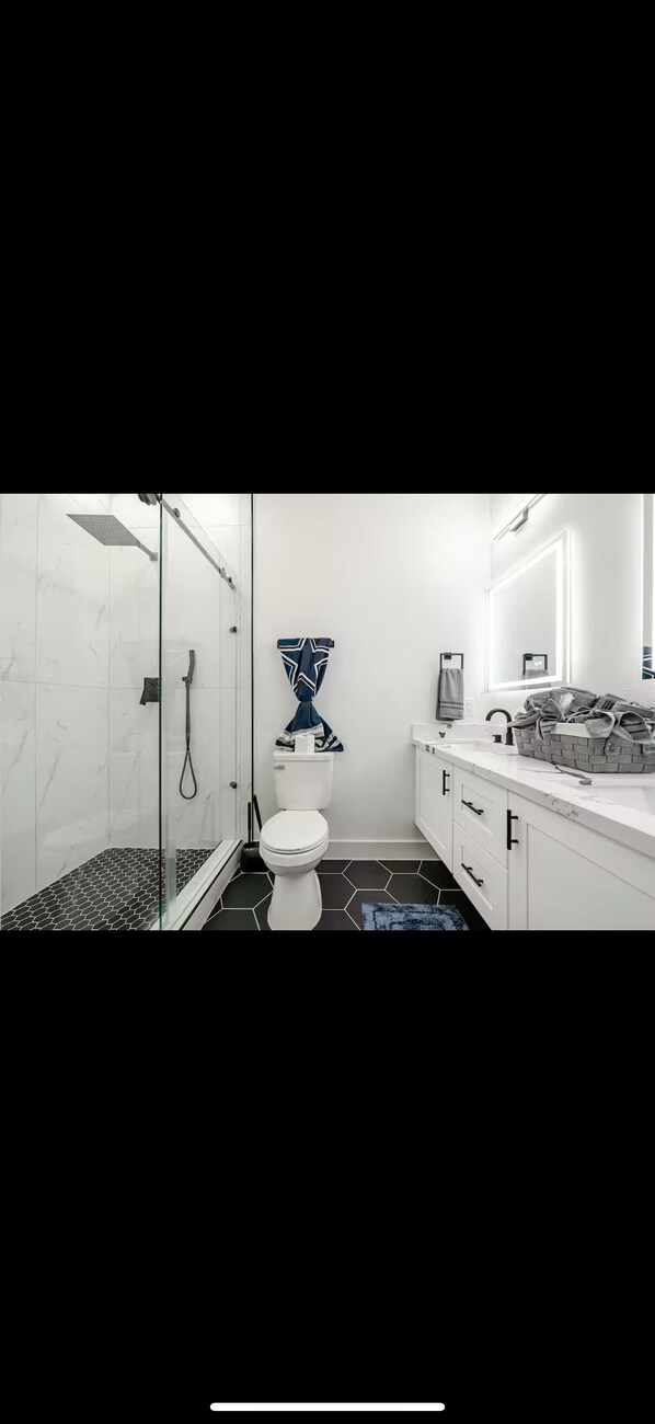 Shower, hair dryer, towels, soap
