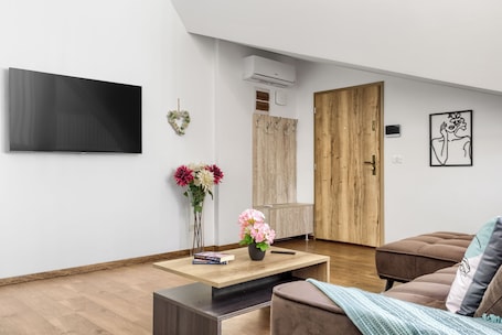 Family Apartment, 2 Bedrooms, Balcony, City View | Living area | 40-cm flat-screen TV with cable channels. ARI Central Grand Apartments-Luxury Stay