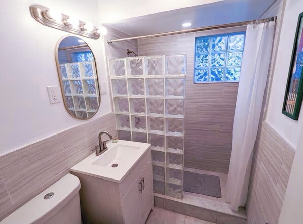 Shower, hair dryer, towels, soap