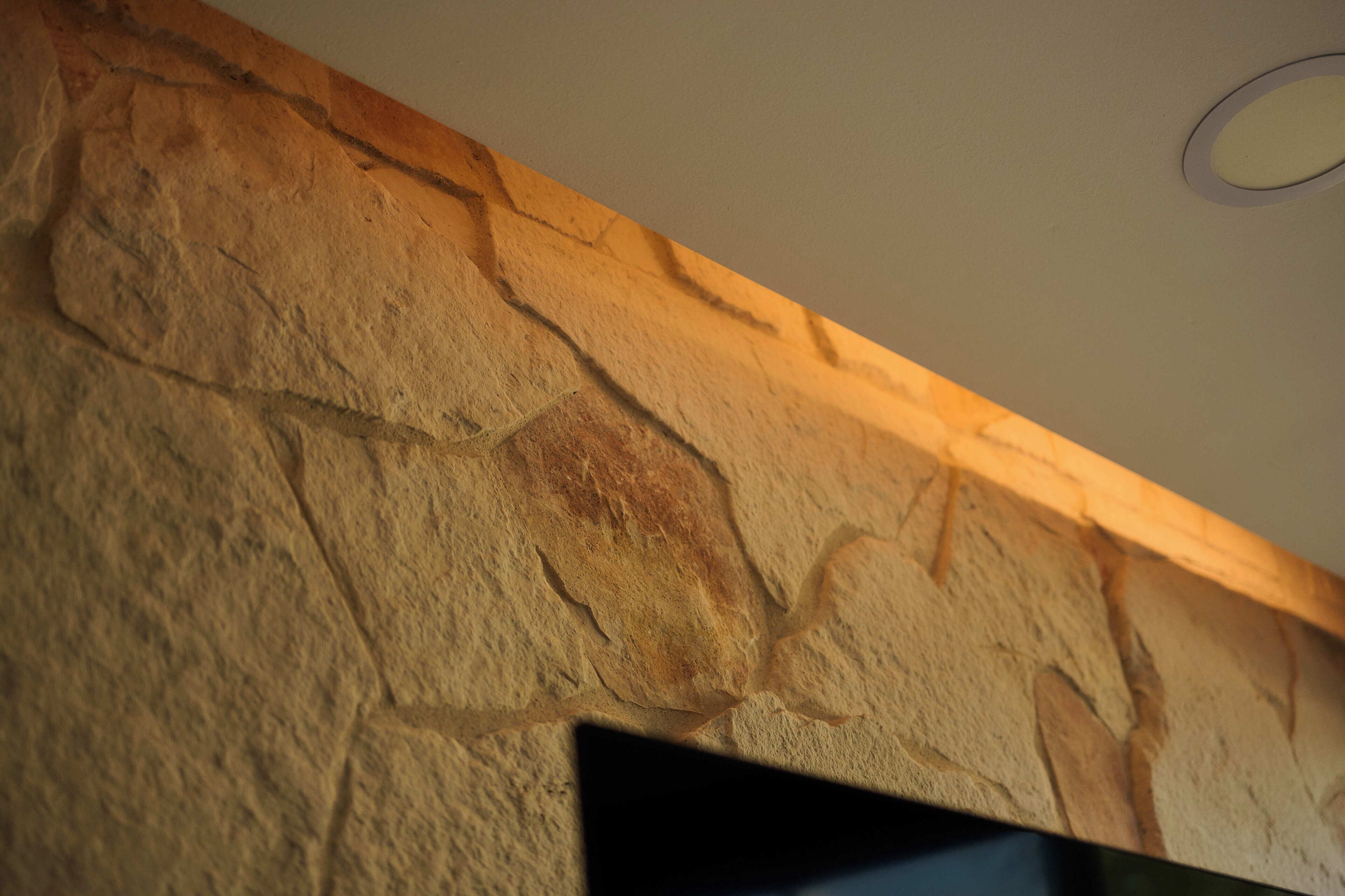 A stone wall with a recessed ceiling.