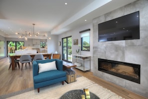 Smart TV, fireplace, books
