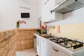 Fridge, microwave, stovetop, cookware/dishes/utensils