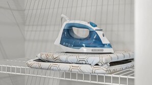 An iron on a shelf in a room with a white, grid-patterned wall. - 1BR Getaway – Perfect Location for Music Lovers! (Nashville)