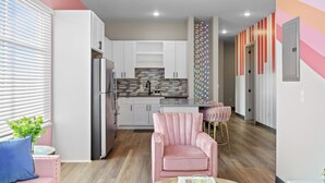 A modern kitchen with white cabinets, a stainless steel refrigerator, and a tiled backsplash. - Perfect for Family Getaway - Mins from Music City! (Nashville)