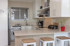 Apartment, Multiple Beds, Patio, Pool View (Lagoon Beach Hotel ) | Private kitchen | Fridge, microwave, oven, stovetop