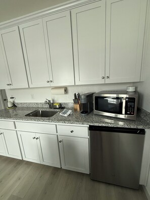 Microwave, coffee/tea maker, toaster, cookware/dishes/utensils