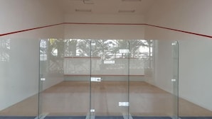 A squash court with glass walls, a red line marking the playing area, and a visible exit sign. - Mykey Silverscape B-39-07 Melaka City (Melaka)