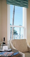 Deluxe Suite, Partial Ocean View | In-room safe, individually decorated, individually furnished
