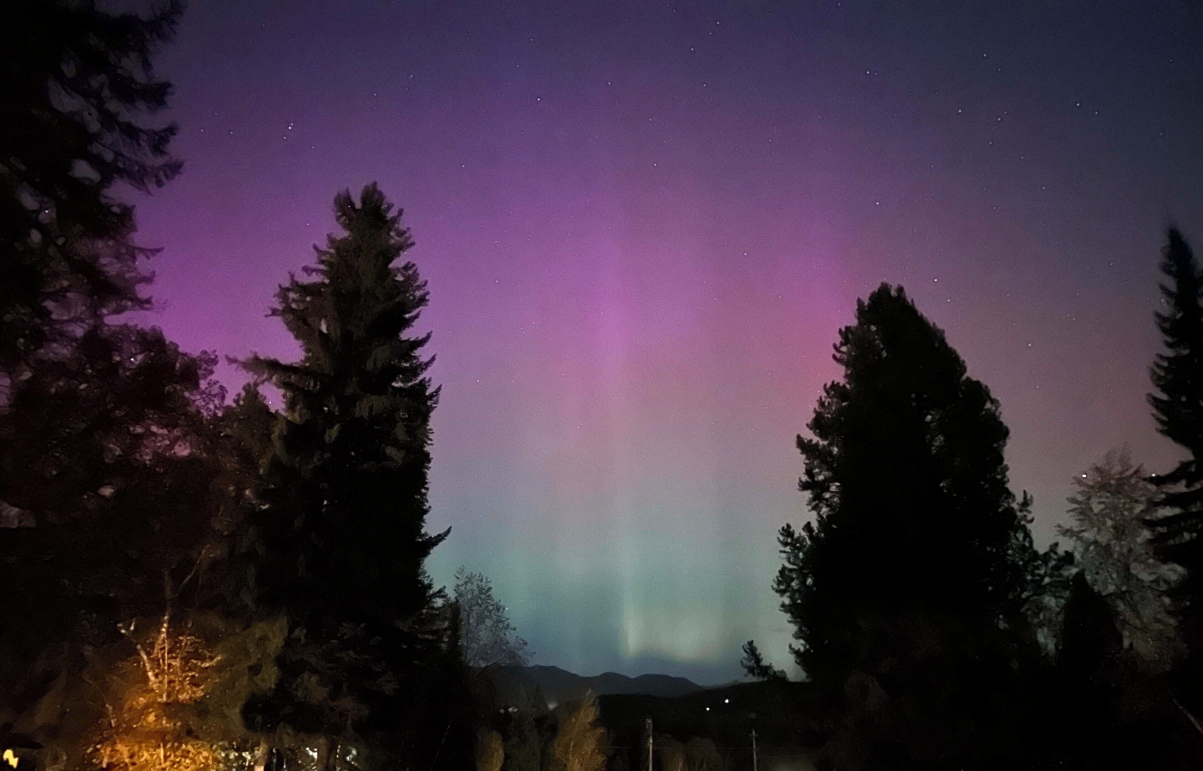 A night sky with the aurora borealis.