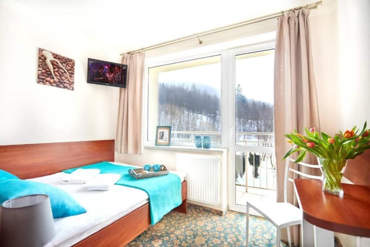 Economy Double Room, Balcony, Garden View | Laptop workspace, free WiFi