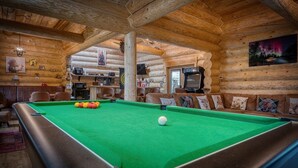 A pool table in a log cabin with a cozy seating area and a television. - The Oak & The Log Cabin, Sleeps 10, 2 Hot Tubs (Oakenshaw)