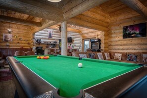 A cozy log cabin interior with a pool table, wooden walls, and a television. - The Barn & The Log Cabin, Sleeps 12, 2 Hot Tubs (Oakenshaw)