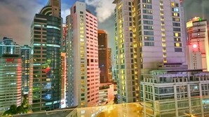 A high-rise hotel with multiple floors, large windows, and a modern architectural design. - Lila Suite One Bukit Ceylon (Kuala Lumpur)