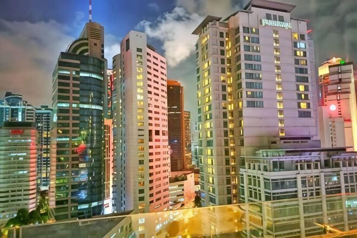 A high-rise hotel with multiple floors, large windows, and a modern architectural design.