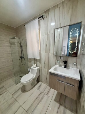 Shower, towels, soap, toilet paper