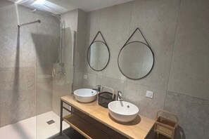 Shower, hair dryer, towels, toilet paper