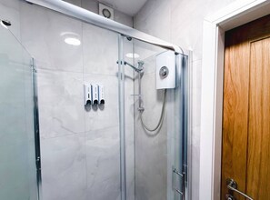 Shower, hair dryer, towels, soap