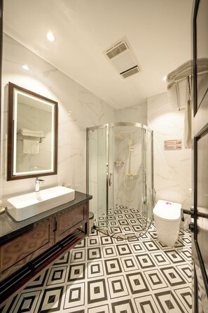 Shower, free toiletries, hair dryer, slippers