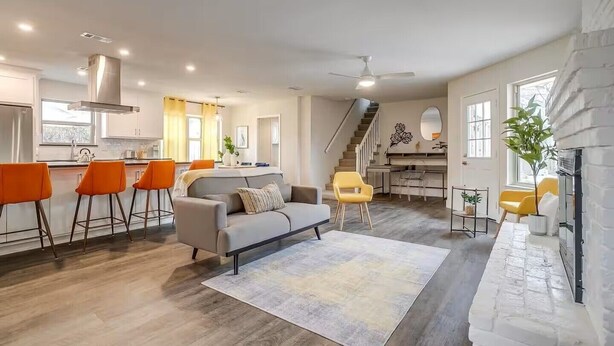A modern living room with a sofa, chairs, and a fireplace. - The Eclectic Oasis - Pool, Games & Family Fun (Grand Prairie)