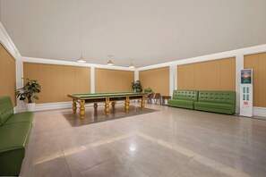 A spacious room with a pool table, green sofa, and a bulletin board. - Laos Guiting Hunan Grand Hotel (Free Airport Transfer with Reservation） (Vientiane)