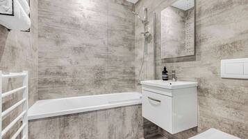 Shower, hair dryer, towels