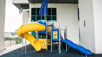 A playground with slides and climbing structures.